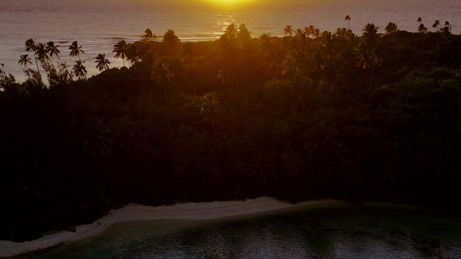 Pacific coastline under a warm island sunset